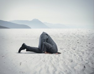 Man with head in the sand