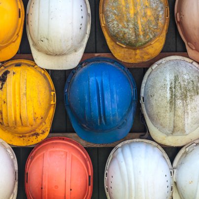 old and worn hard hats